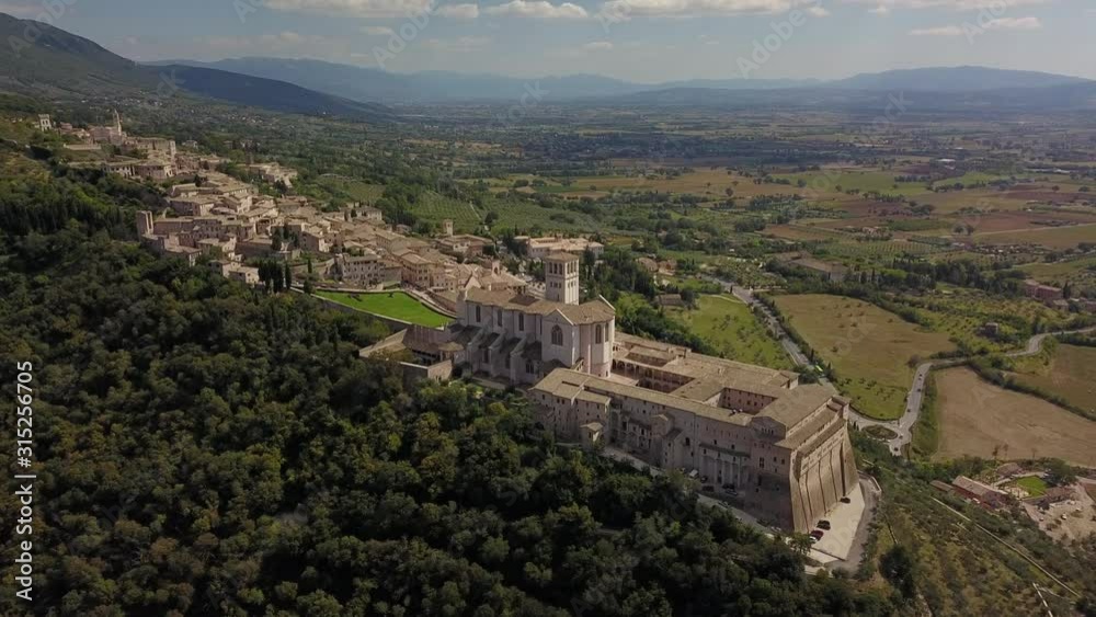Aerial Drone Shot of Assisi Town in Umbria Italy, Beautiful Italian Hillside City and Town during Summer Aerial Drone Shot of Assisi Town in Umbria Italy, Beautiful Italian Hillside City and Town during Summer