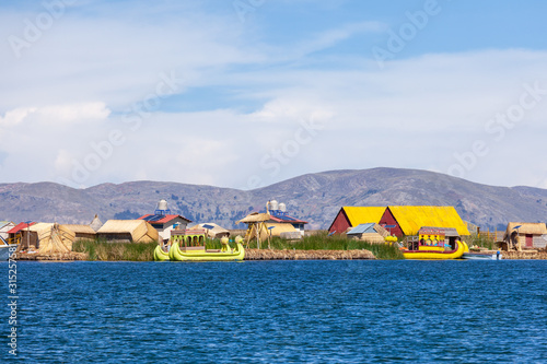 View of the village floating Uros islands on lake Titicaca in Peru, South America.
