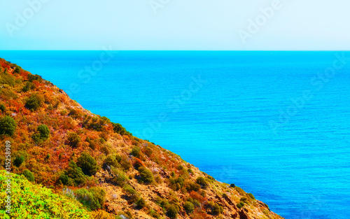 Cala Domestica beach in Buggerru resort at the Mediterranean Sea near Masua and Cagliari province in Carbonia-Iglesias, Sardinia in Italy. Landscape and scenery. photo