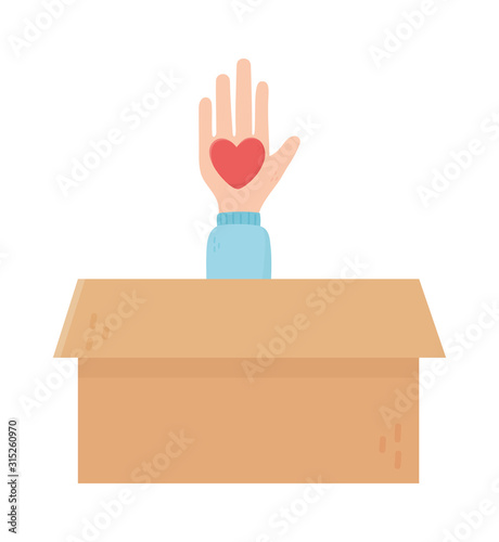 hand with heart in cardboard box charity and donation concept
