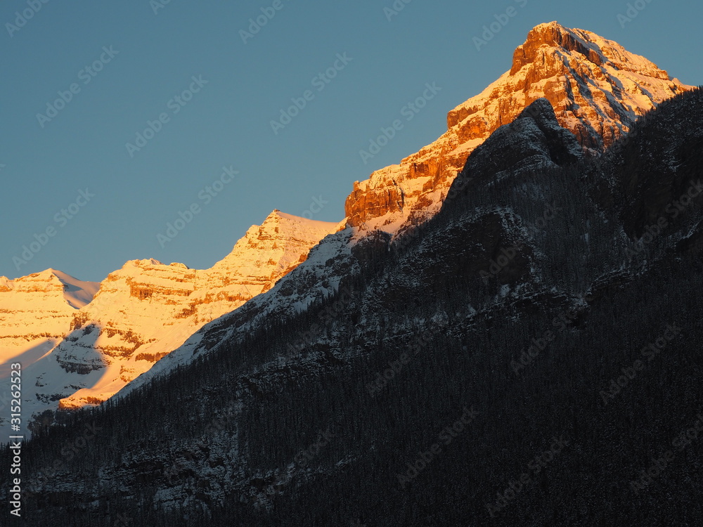 OLYMPUS DIGITAL CAMERA   Mount Whyte lights up in rising sun at Lake Louise, Canadian Rockies