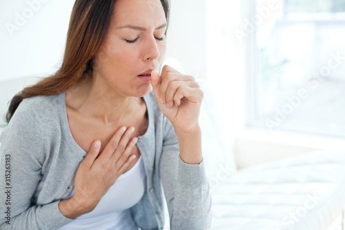 Young woman coughing