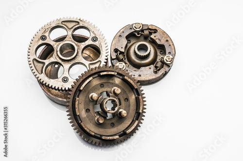 old Parts of the motorcycle engine has been placed on a white background.