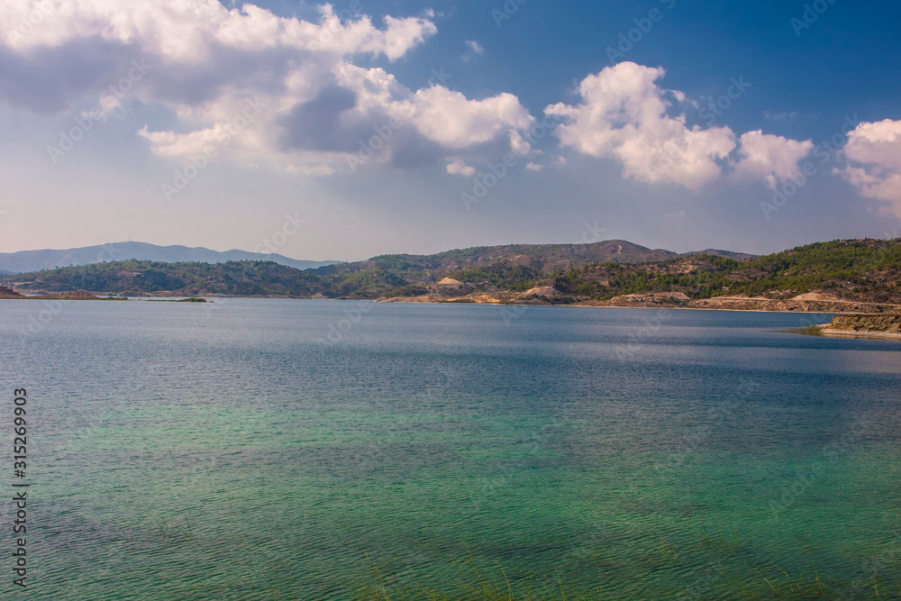 Fototapeta premium turquoise lake surrounded by mountains on the island of Rhodes