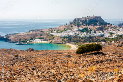 Fototapeta Naklejka Na Ścianę i Meble -  ancient castle towering on a mountain above the sea