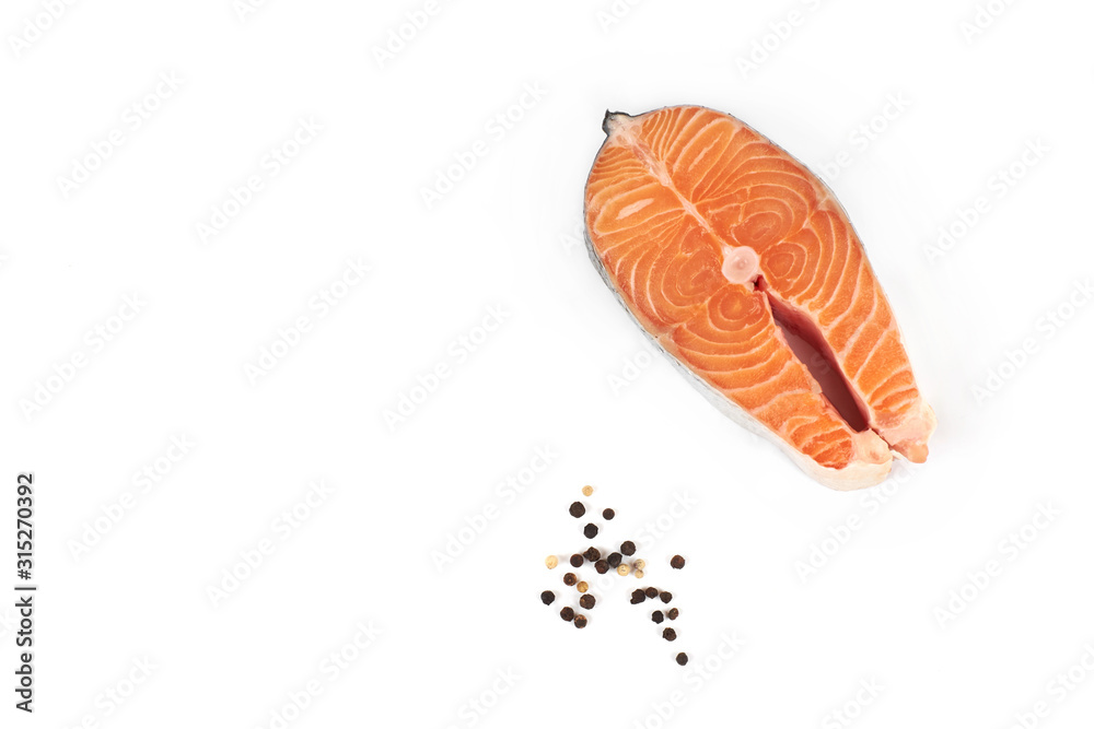 fresh steak of a salmon isolated on white background. fresh steak of a salmon isolated on white background.