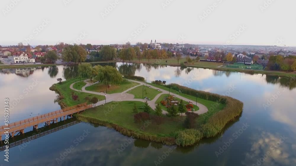 Aerial rising shot of city island footbridge, Suwalszczyzna, Poland Aerial rising shot of city island footbridge, Suwalszczyzna, Poland
