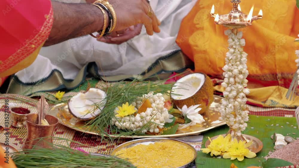 Detailed Hindu traditional celebration with oil and petal tossing Detailed Hindu traditional celebration with oil and petal tossing