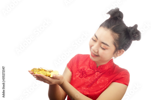 Portrait Asian young  woman red dress traditional cheongsam holding a gold coin at the white background
