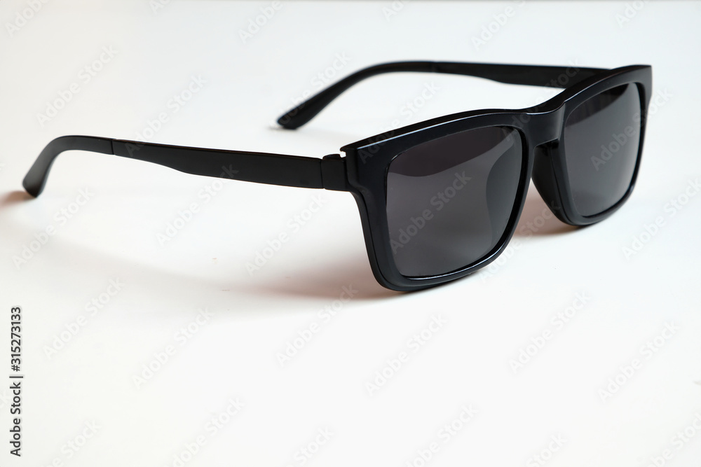Black sunglasses, black frame isolated on a white clean background.