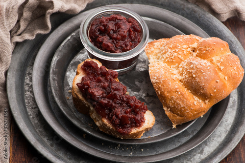 Sweet bread (challah) with cherry jam
