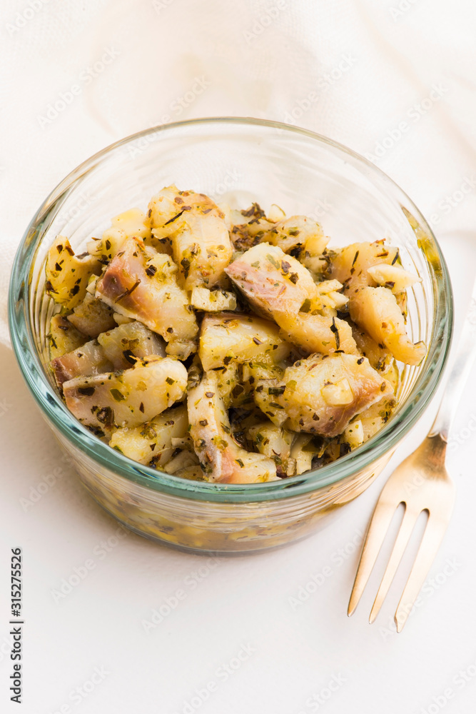 Herring salad with garlic, herbs and olive oil Herring salad with garlic, herbs and olive oil