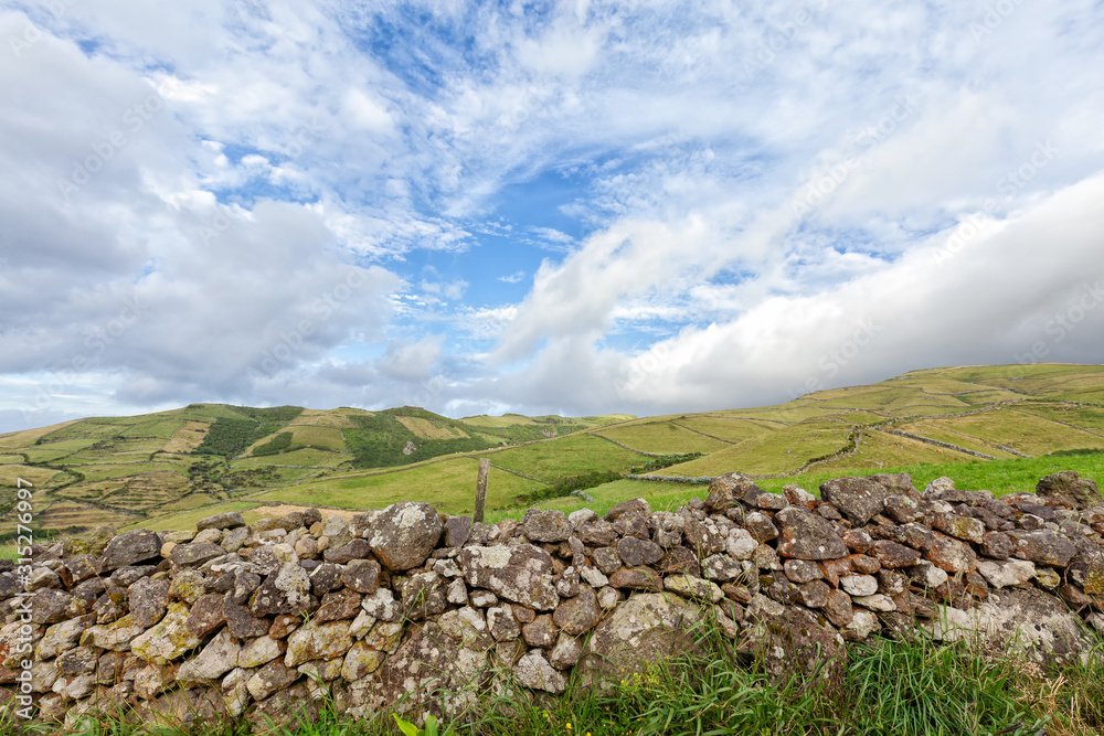 A rocky hand built wall in the rural area of northern Flores on the island of Flores in the Azores, Portugal.