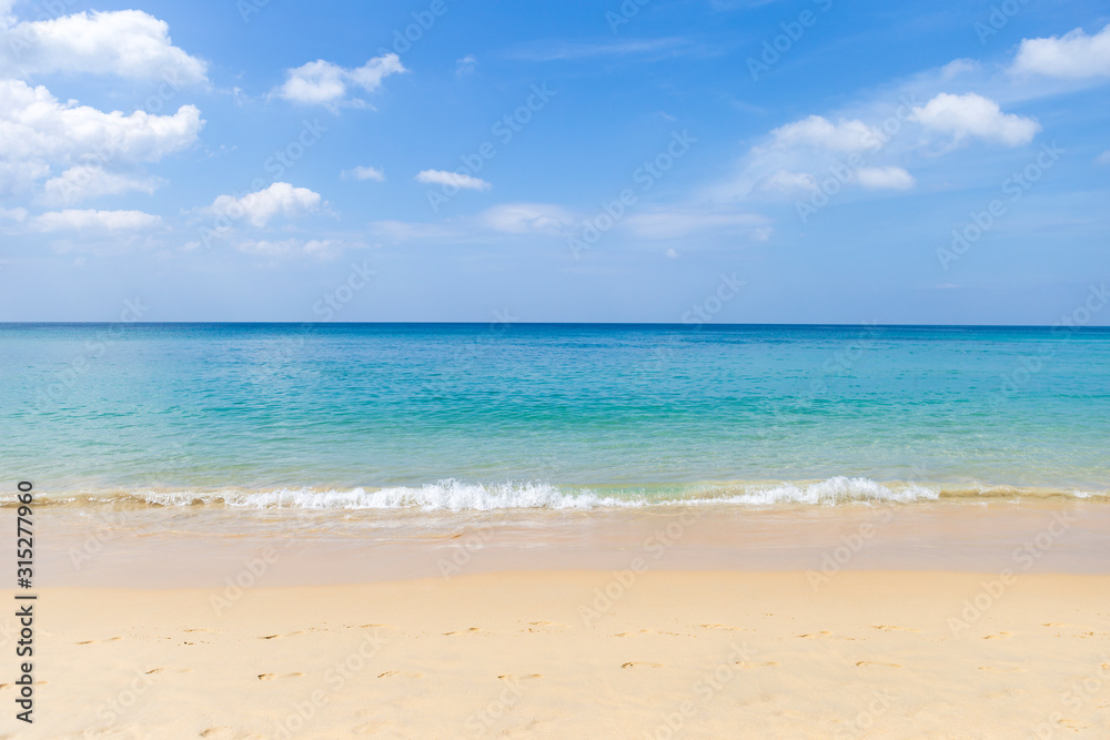 Peceful beach with blue sky and blue sea, relaxing by the beach, holiday and vacation to Tropical island in Southern Thailand, summer outdoor day light