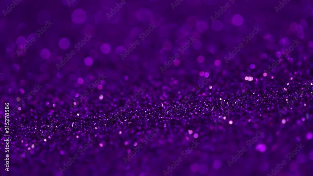 Sequin backdrop. Bokeh rotation background.Holiday abstract glitter background with blinking lights. Rotated Holiday  glitter backdrop.Violet shiny background. Valentine's day concept.