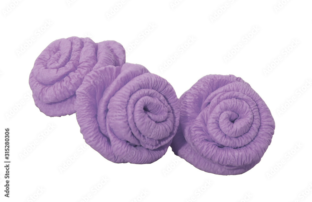 Three lilac decorative rose flowers on a white background isolated. Craft from polymer clay. Three lilac decorative rose flowers on a white background isolated. Craft from polymer clay.