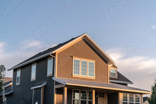 Brown double storey house facade in evening light