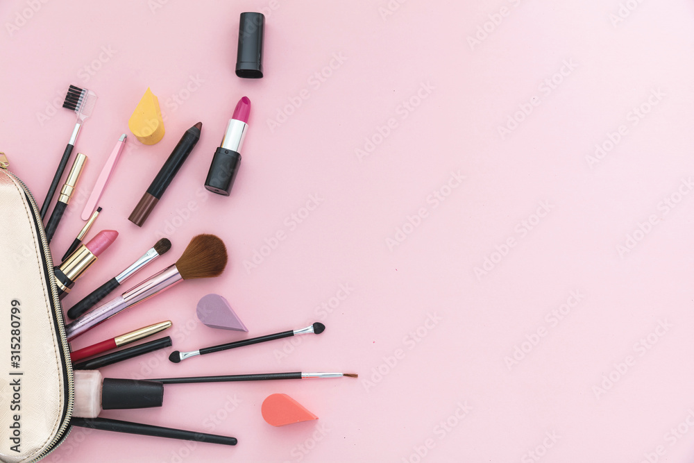 Make-up cosmetic bag against pink background, copy space Make-up cosmetic bag against pink background, copy space