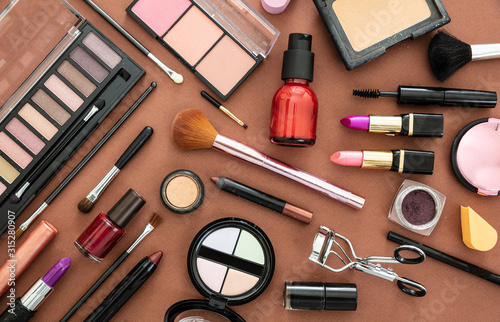 Make up cosmetics products against brown color background