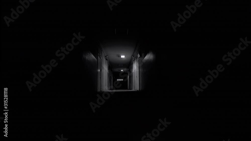 Point of View of Walking Down Ominous Scary Corridor Horror Thriller Scene With Glowing Flashing Light Effects photo