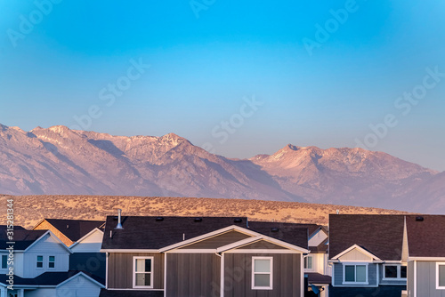 View of a mountains behind American town © Jason