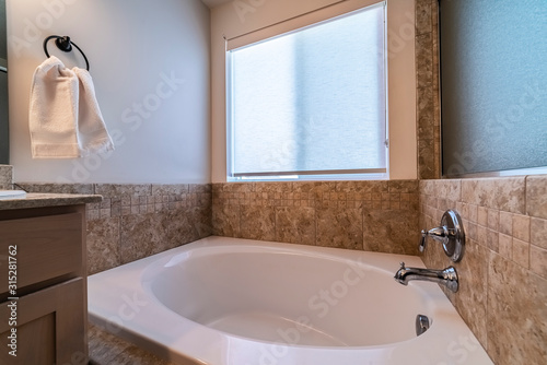 Small compact spa bath or jacuzzi day light