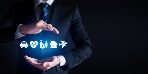 Businessman with protective gesture and car, family, life, travel and health insurance icons. Insurance concept. copy space