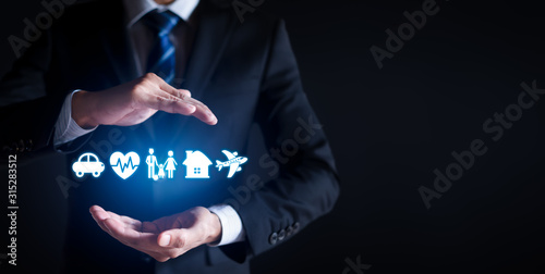 Businessman with protective gesture and car, family, life, travel and health insurance icons. Insurance concept. copy space