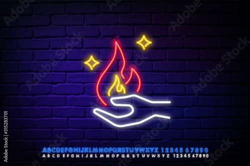 The fire on the arm neon icon. Circus flaming magic fire against a dark brick wall. Night bright advertising. Vector illustration in neon style for circus performance or dangerous trick