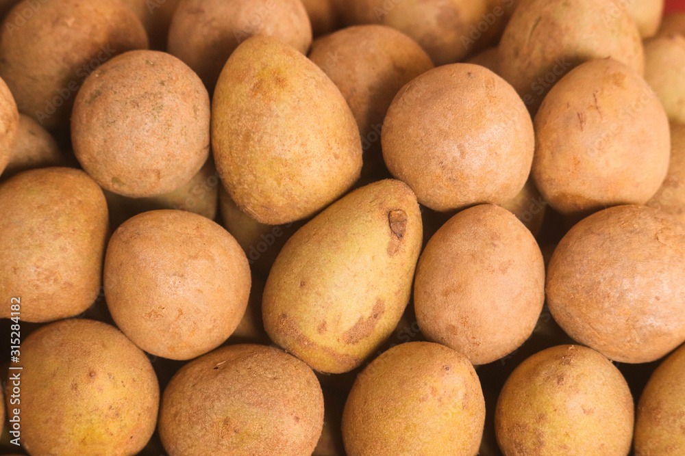 Stack Of Sapodilla Indian Chikoo Manilkara Zapota Naseberry Or Nispero Fruit Fresh From Farm Stack Of Sapodilla Indian Chikoo Manilkara Zapota Naseberry Or Nispero Fruit Fresh From Farm