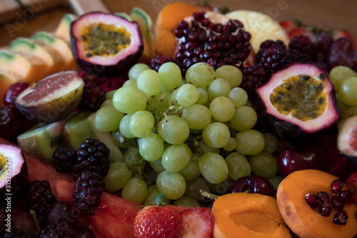 Christmas fruit platter with grapes, passionfruit, strawberries, peaches & raspberries © mleane28