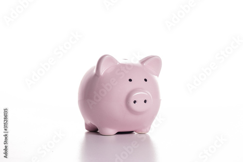 Pink pig piggy bank on a white background. The concept of savings and savings  financial management