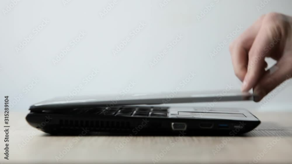 Close up of the hands typing on laptop keyboard .A man sitting in a office and working on a computer. Close up of the hands typing on laptop keyboard .A man sitting in a office and working on a computer.