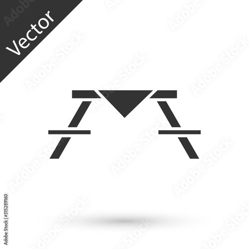 Grey Picnic table with benches on either side of the table icon isolated on white background. Vector Illustration