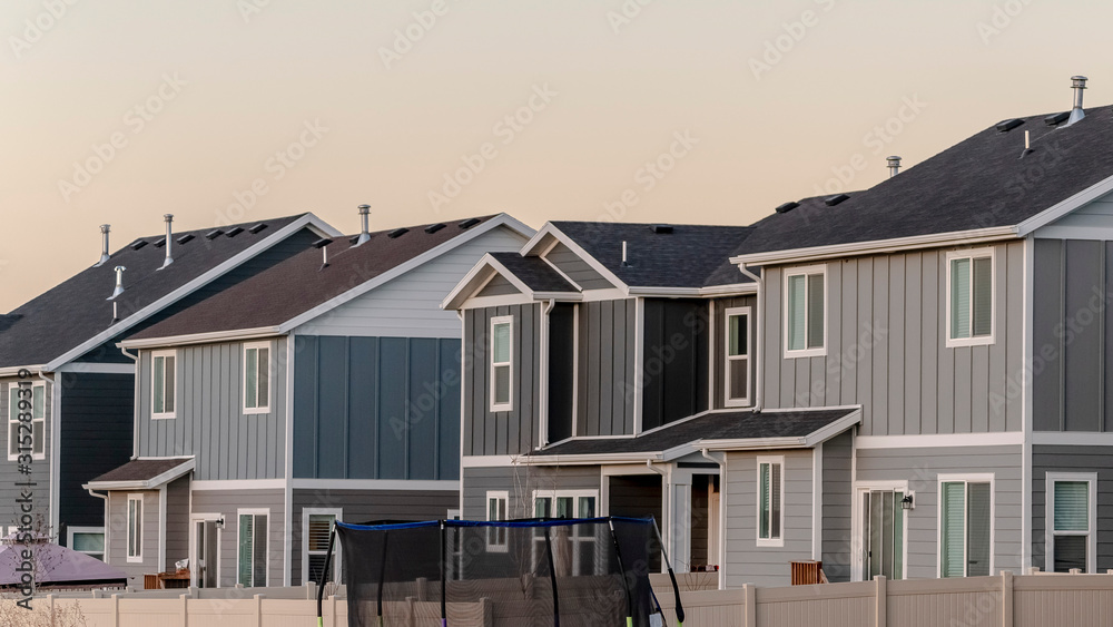 Panorama frame Two story American houses backyards day light Panorama frame Two story American houses backyards day light