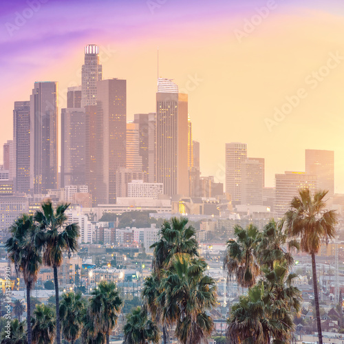 Valokuvatapetti Amazing sunset view with palm tree and downtown Los Angeles