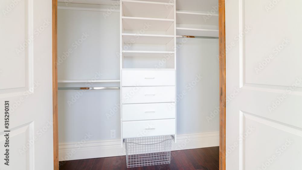 Panorama frame Empty shelves of a luxury walk-in closet Panorama frame Empty shelves of a luxury walk-in closet