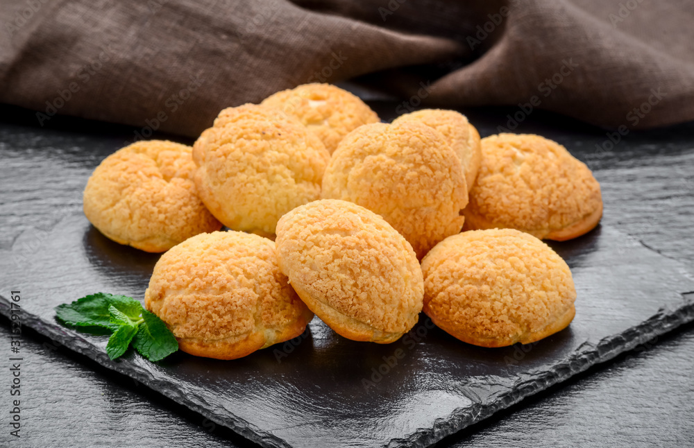 Amaretti cookies in a glass bowl on old wooden background Amaretti cookies in a glass bowl on old wooden background