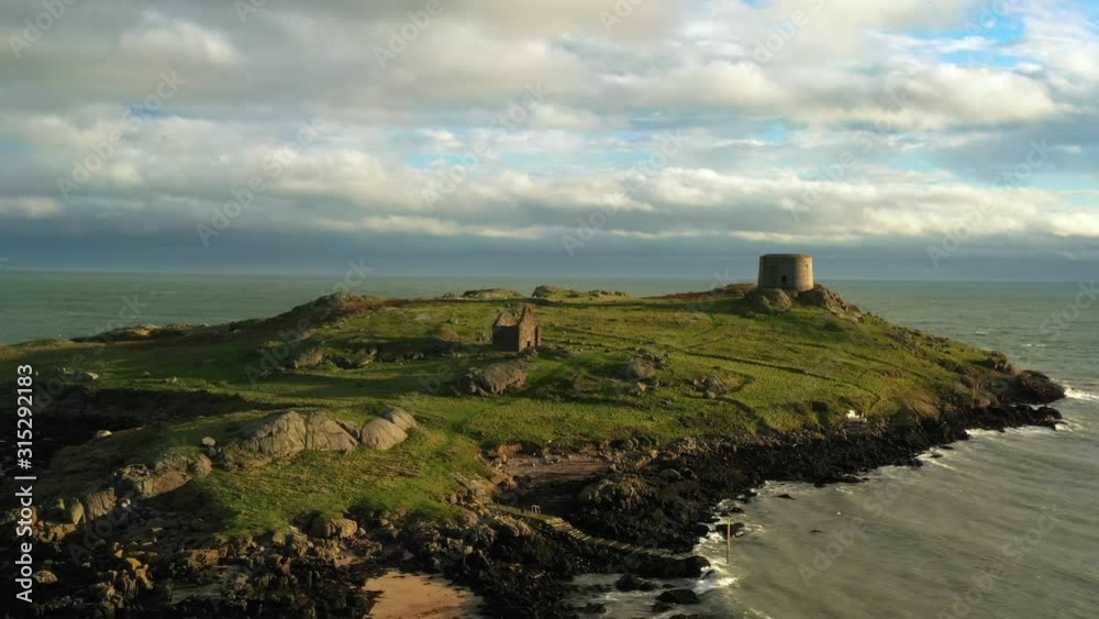 Dalkey Island, Dublin, Ireland, January 2020, Drone, Pushing past St. Begnet Church and Martello Tower revealing Ruined Fort Dalkey Island, Dublin, Ireland, January 2020, Drone, Pushing past St. Begnet Church and Martello Tower revealing Ruined Fort