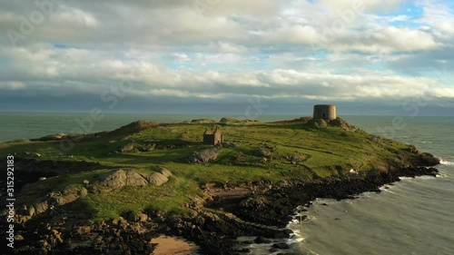 Dalkey Island, Dublin, Ireland, January 2020, Drone, Pushing past St. Begnet Church and Martello Tower revealing Ruined Fort photo