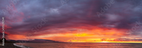 beautiful panorama sea landscape with a sunset. evening colorful sky with clouds over ocean. sky with clouds panoramic view