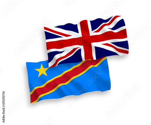 National vector fabric wave flags of Great Britain and Democratic Republic of the Congo isolated on white background. 1 to 2 proportion.