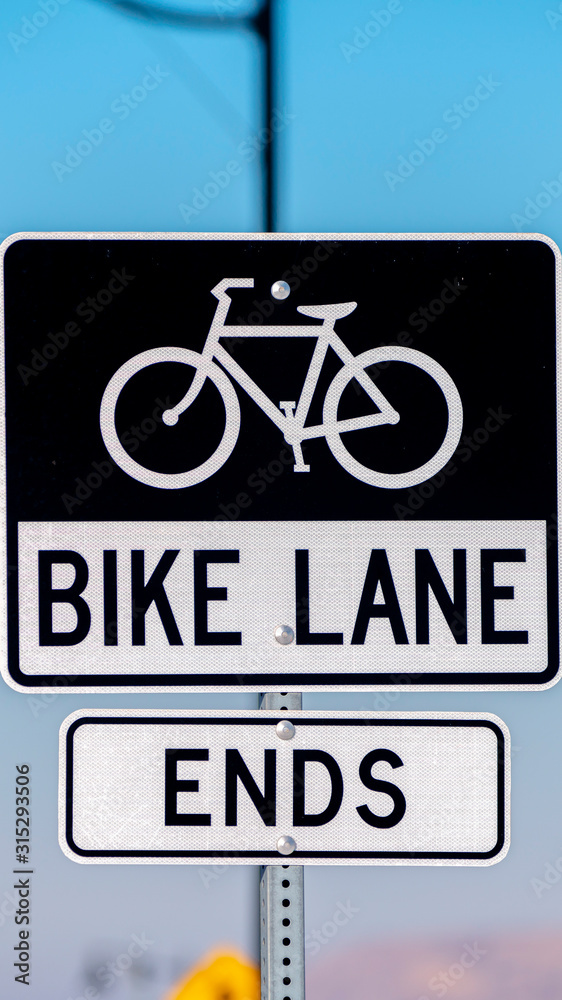 Fototapeta premium Vertical Warning traffic sign for the end of a Bike lane