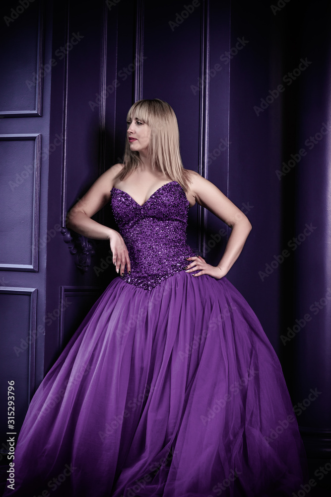 Mystical woman in violet vintage evening dress, fashionable concept