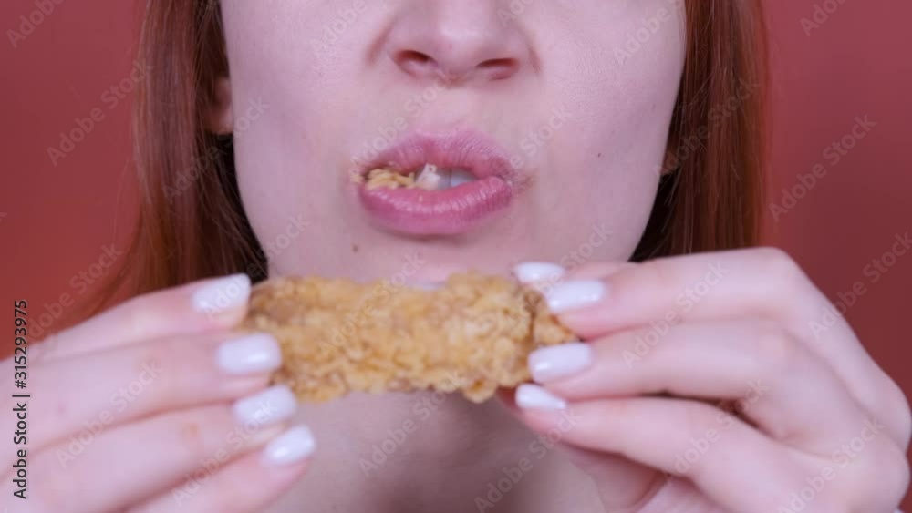 close-up, woman eats, fast food, chicken nuggets. 4k close-up, woman eats, fast food, chicken nuggets. 4k
