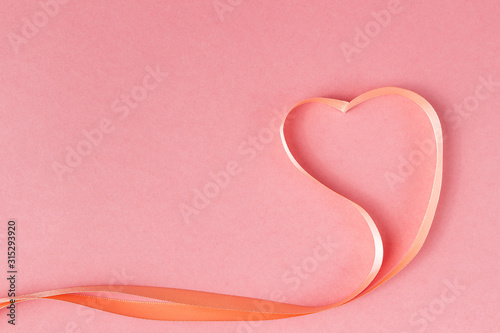 Heart shaped ribbon on a pink background. Valentine s Day Gift