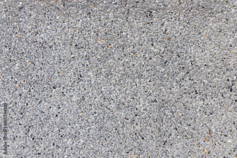 Close up texture of Light Grey washed gravel stone wall pattern background. Close up texture of Light Grey washed gravel stone wall pattern background.