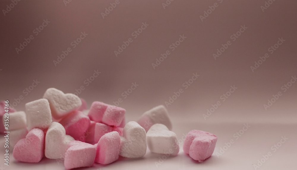 Pink and white marshmallows in the shape of hearts copy space. Pink and white marshmallows in the shape of hearts copy space.