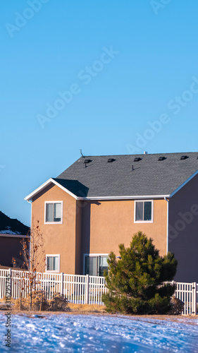 Vertical Two story house in American town in winter