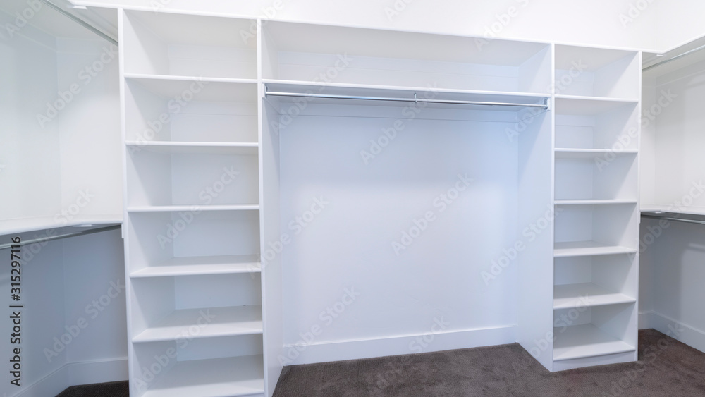 Panorama frame Empty fitted interior of a walk-in closet Panorama frame Empty fitted interior of a walk-in closet